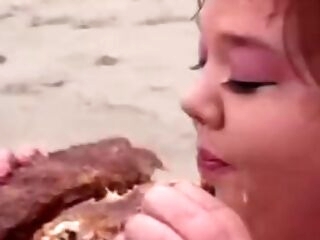 Big lifeguard bitches eat food on the beach